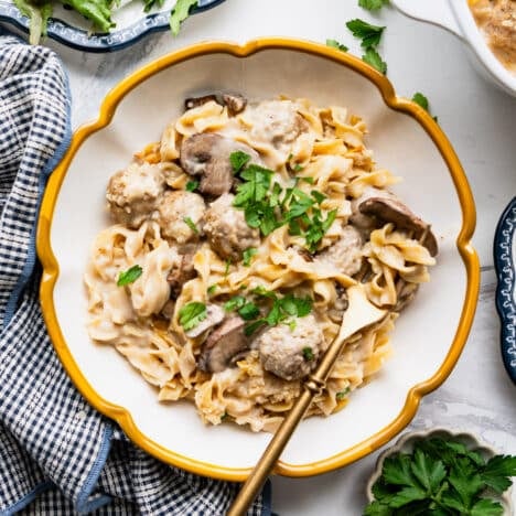 Square overhead shot of a bowl of beef stroganoff casserole.