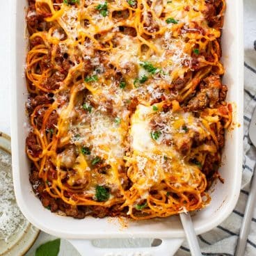 Square overhead shot of easy baked spaghetti in a white dish.