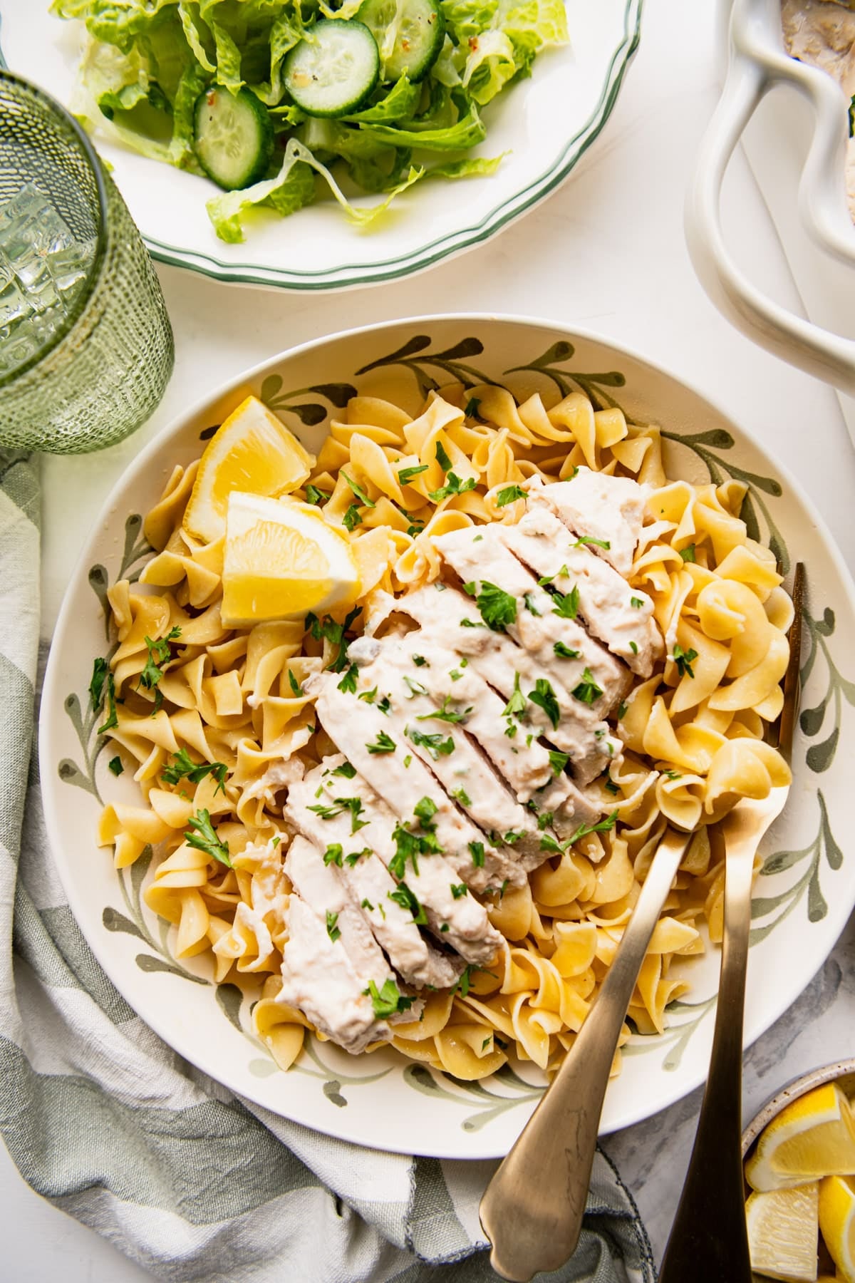 Overhead shot of a bowl of egg noodles topped with cream of mushroom chicken.