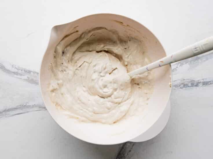 Stirring together the cream of mushroom sauce.