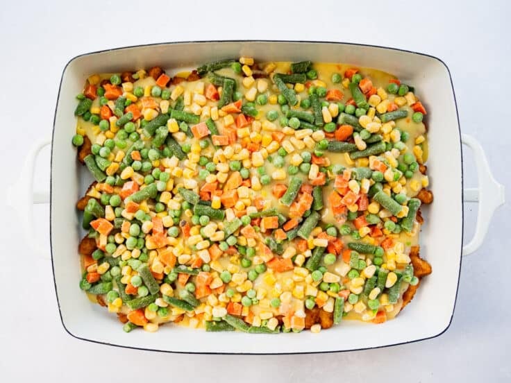 Frozen mixed vegetables on top of the creamy sauce.