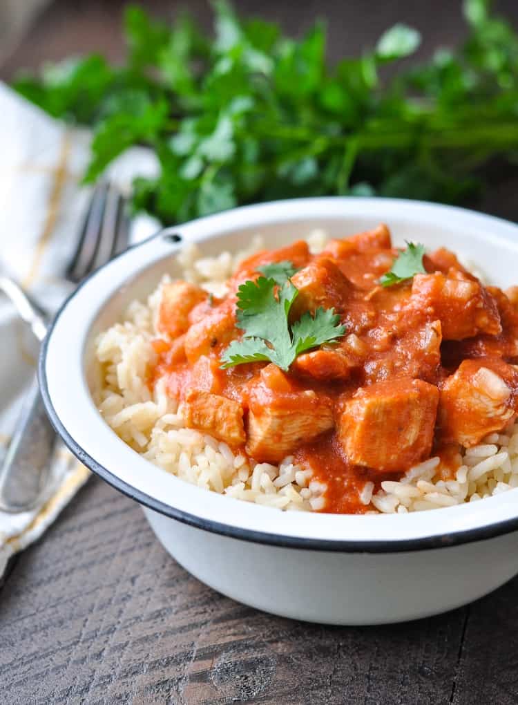 Close image of bowl of chicken tikka masala with rice