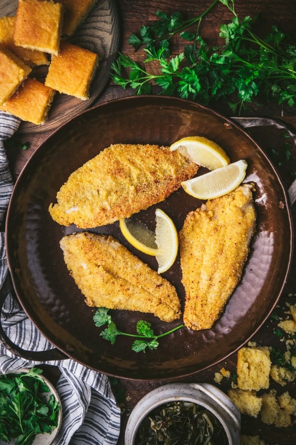Fried catfish fillets in a cast iron skillet