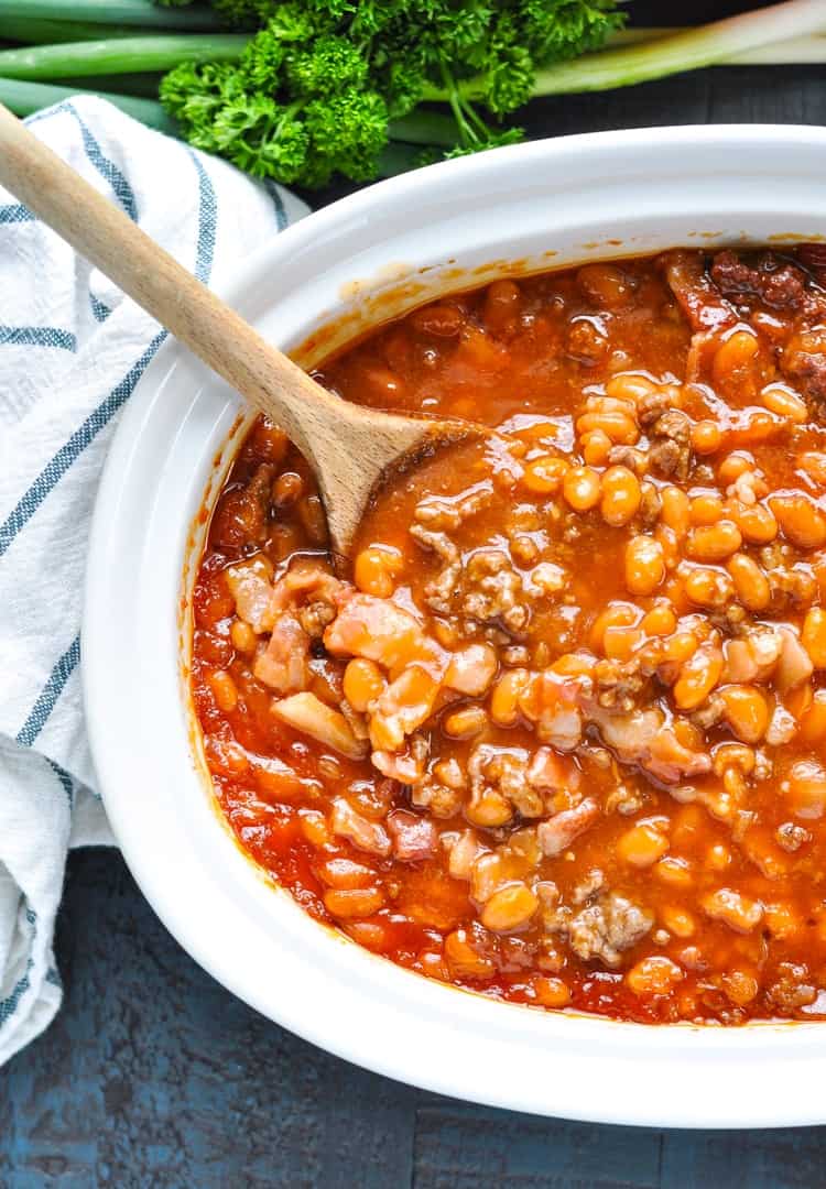 Overhead image of Easy Baked Beans with ground beef and bacon in a casserole dish