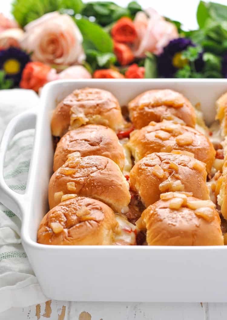 A close up of a tray of Kentucky hot brown sliders
