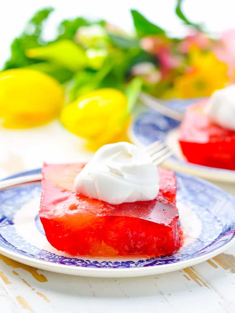Slice of Strawberry Jello Salad on a plate.