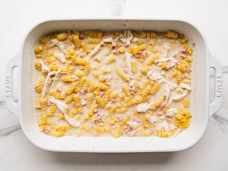 Stirring the casserole while it's baking.