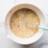 Whisking the custard for French toast casserole.