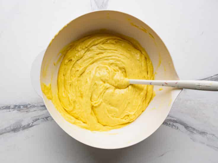 Batter for lemon bars with cake mix in a mixing bowl.