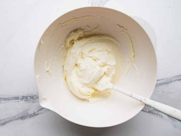 Cream cheese frosting in a bowl.