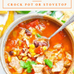 Overhead shot of a bowl of chicken tortilla soup with a text title box at the top