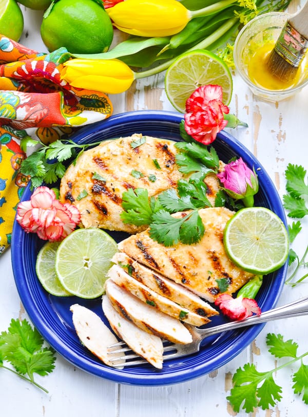Sliced grilled Cuban Mojo Chicken breasts for a healthy dinner in less than 30 minutes.