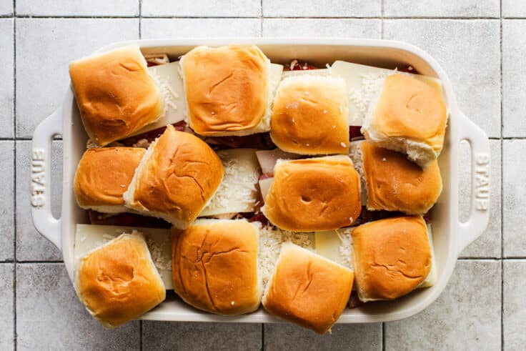 Process shot showing how to assemble and arrange hot brown sliders.