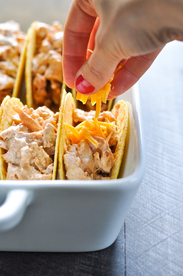 Top these chicken tacos with grated cheese