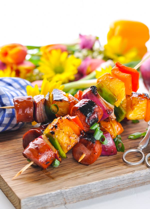 A simple tropical dinner comes together on the grill or campfire in just minutes for these Hawaiian Kielbasa Kabobs!