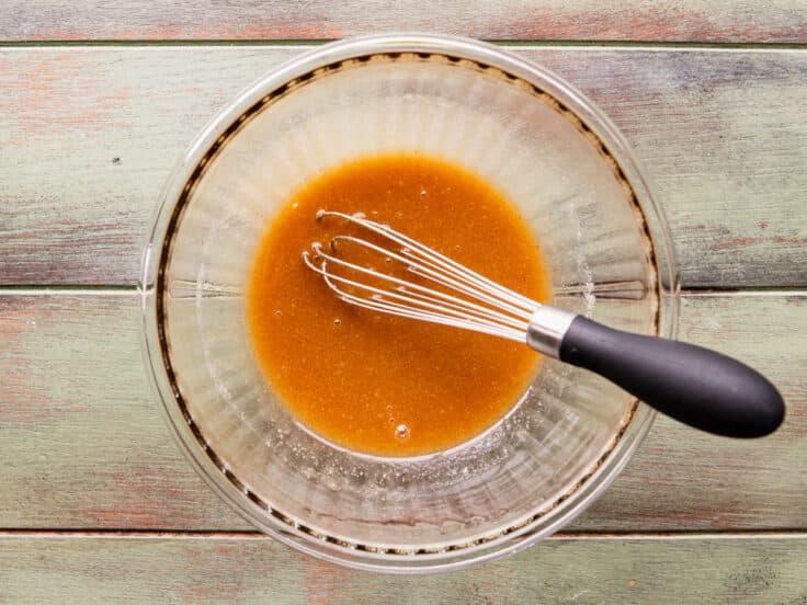 Whisking together the sauce.