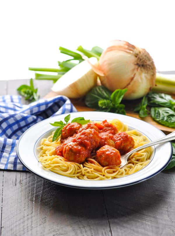 Healthy turkey meatballs in a bowl of spaghetti with marinara