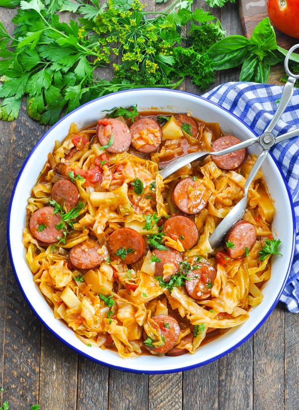 Bowl of kielbasa sausage and cooked cabbage for an easy dinner recipe