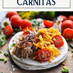 Crispy carnitas on a plate with text title box at top