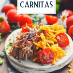 Carnitas tacos on a wooden board with text title overlay