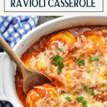 Overhead shot of baked ravioli casserole with text title box at top
