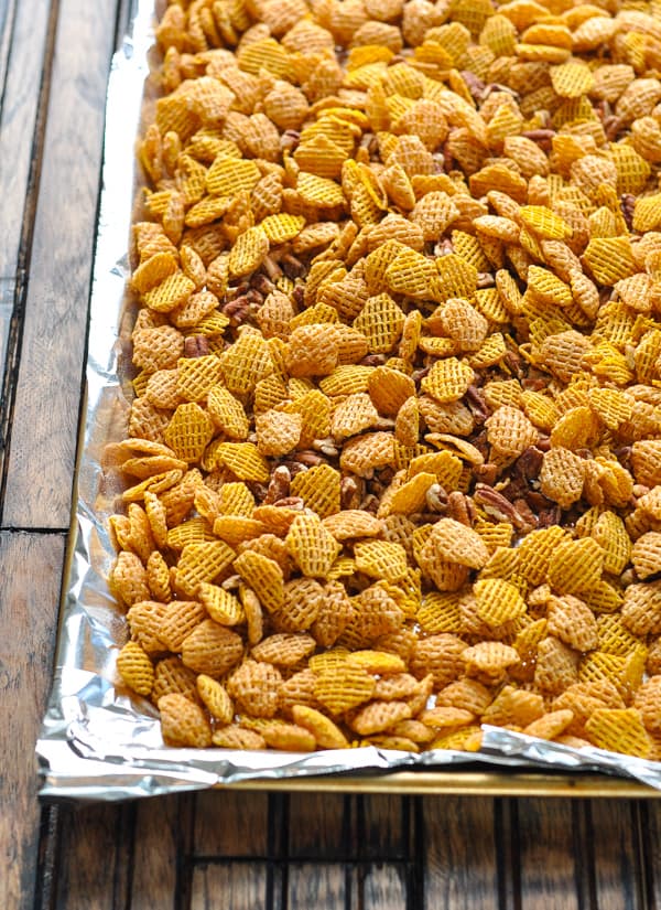 Crispix cereal and pecans on baking sheet