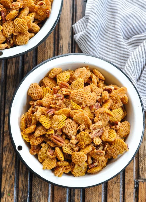 Close overhead image of sweet and salty snack mix recipe in a white bowl
