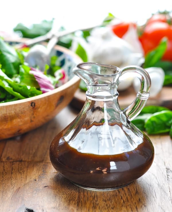 Close up front shot of the best balsamic vinaigrette recipe in a glass bottle
