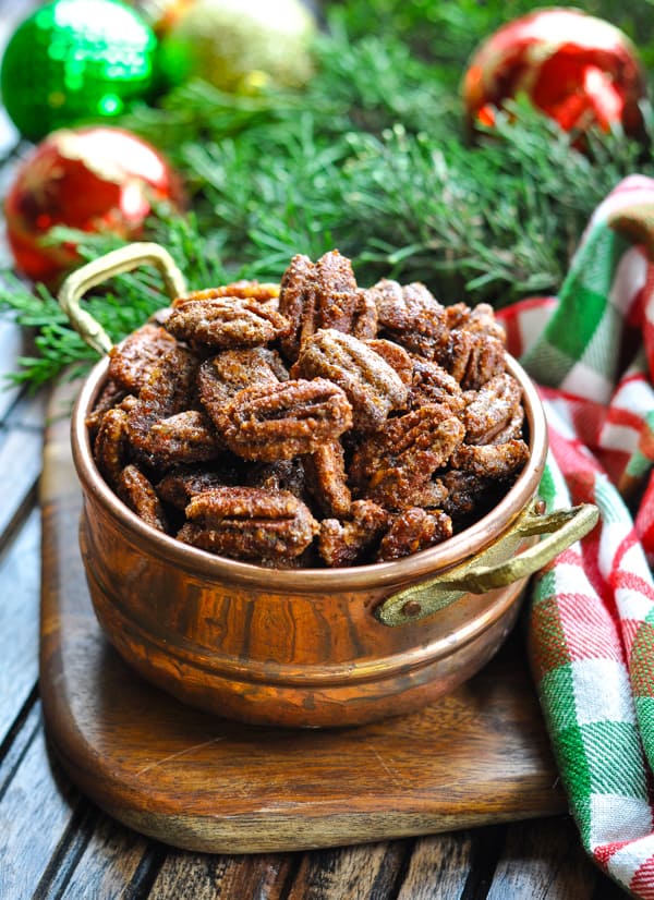 Candied pecans in a small copper bowl