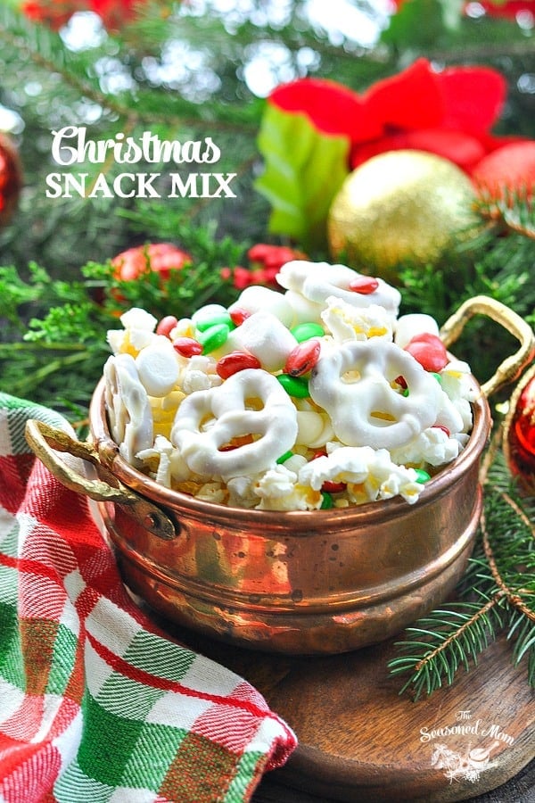 Christmas Snack Mix in a copper bowl with text overlay