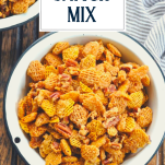 Overhead shot of a bowl of cereal snack mix with text title overlay