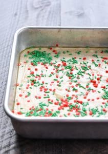 Microwave fudge in a pan with sprinkles on top