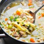 Easy turkey noodle soup on a ladle with text overlay