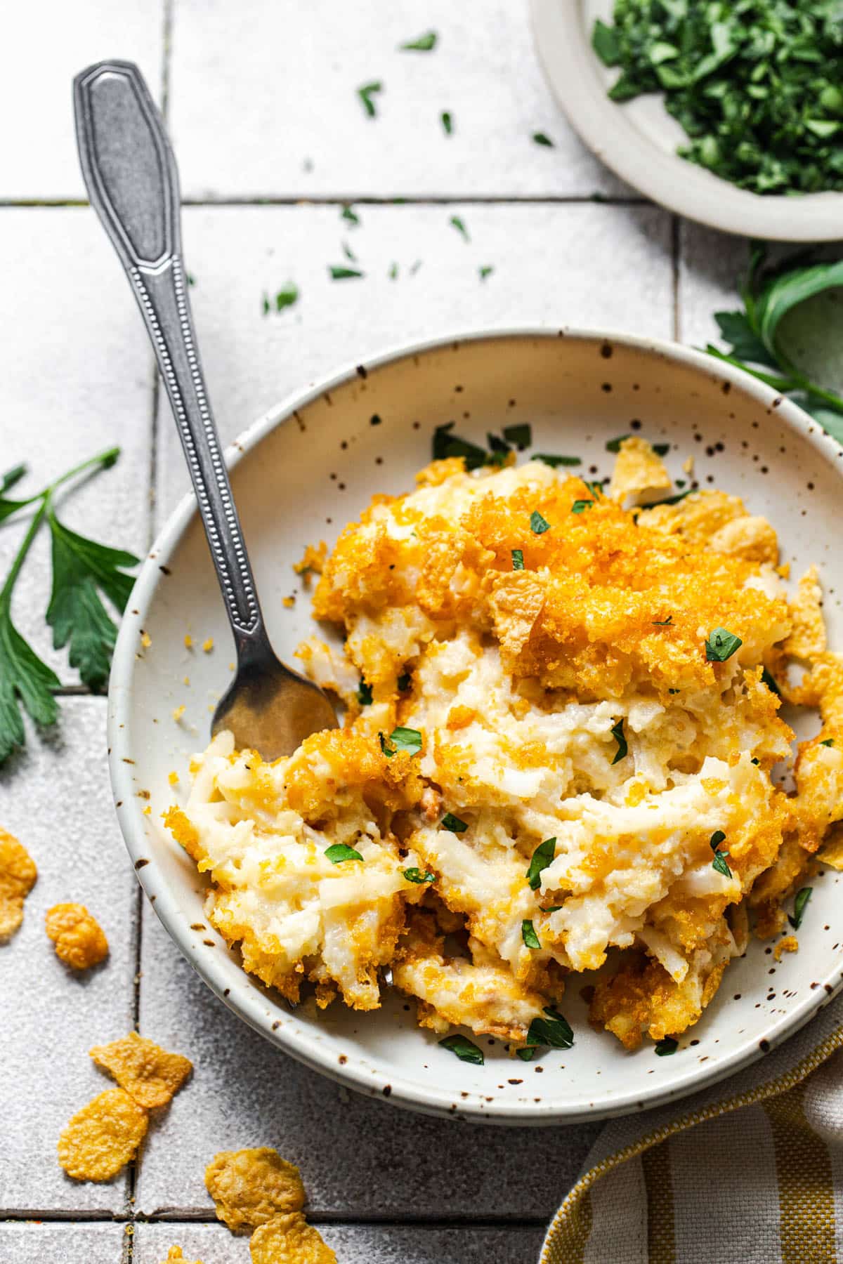 Cheesy hash brown casserole served in a bowl.