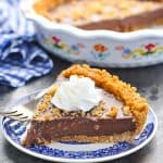 Slice of chocolate pudding pie on blue and white pie plate