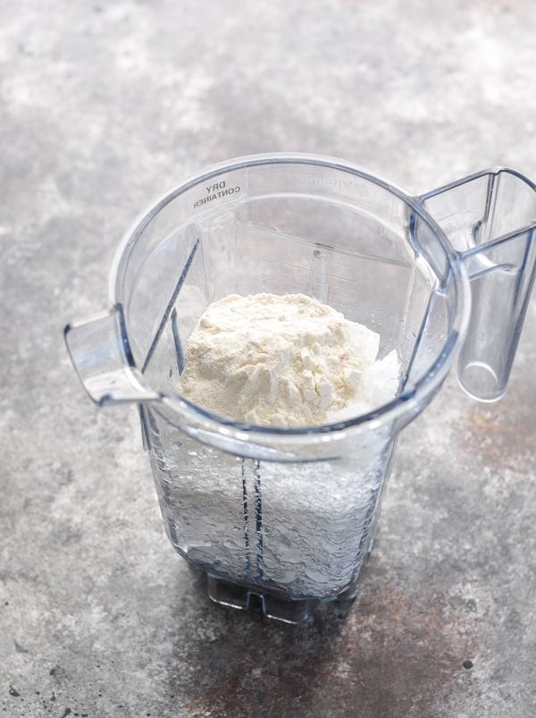 Dry ingredients for cookies and cream protein shake in a blender