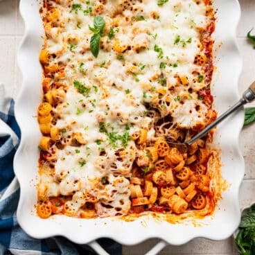 Square overhead shot of dump and bake wagon wheel pasta casserole in a white dish.