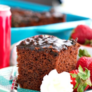 Slice of Coca Cola Cake on a teal plate