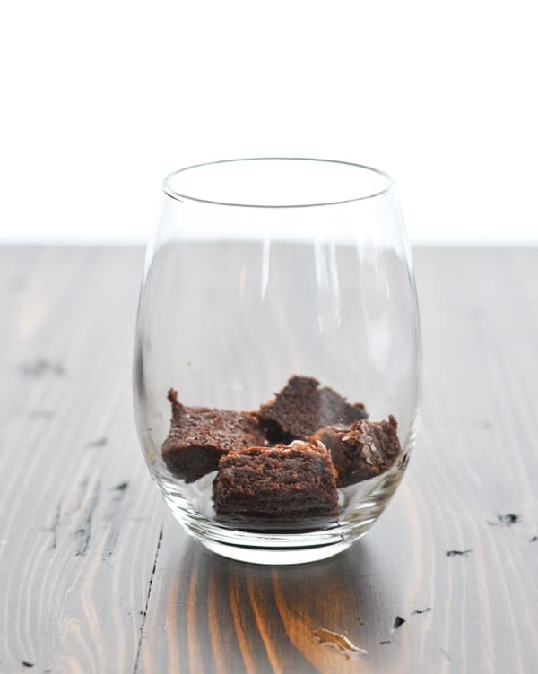 Chopped brownies in the bottom of a glass