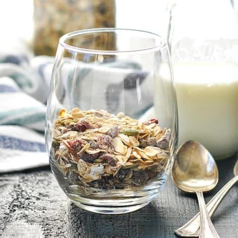 Square side shot of a glass of muesli with milk