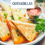 Side shot of a plate of pizza quesadillas with text title overlay