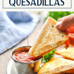 Dipping the best pizza quesadilla recipe with text title box at top