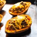 Taco stuffed potatoes with melted cheese on top