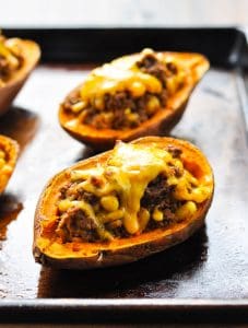 Taco stuffed potatoes with melted cheese on top