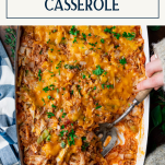 Hands serving unstuffed cabbage roll casserole recipe with text title box at top