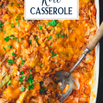 Close up shot of spoon in a dish of cabbage roll casserole with text title overlay