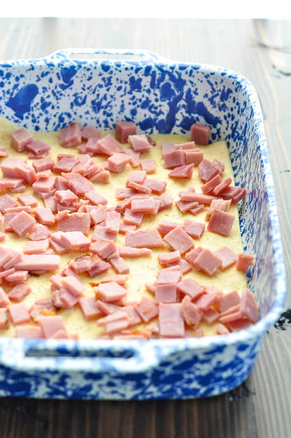 Diced ham on crescent dough in baking dish