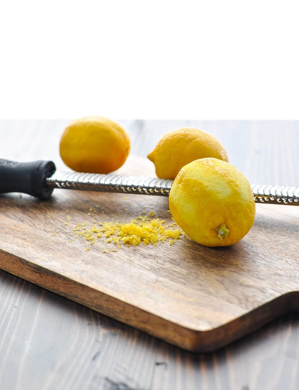 Zesting lemon on cutting board