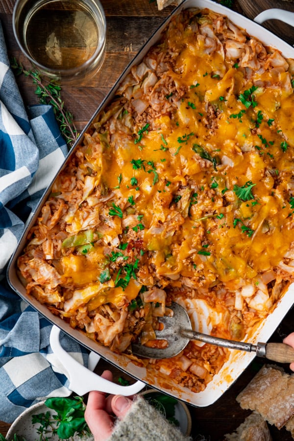 Overhead shot of unstuffed cabbage roll casserole on a wooden dinner table