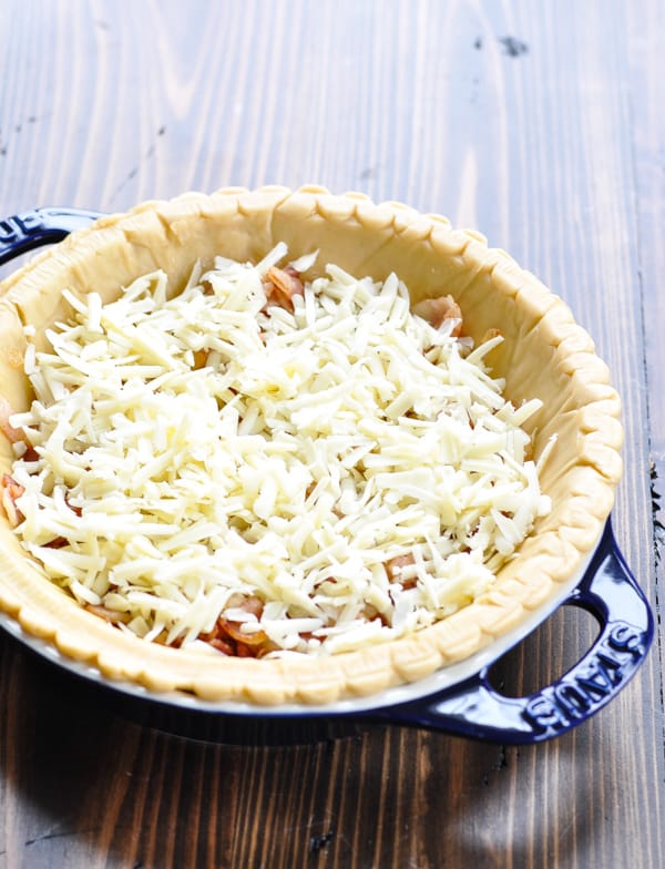 Bacon onion and cheese in a pie crust for quiche lorraine